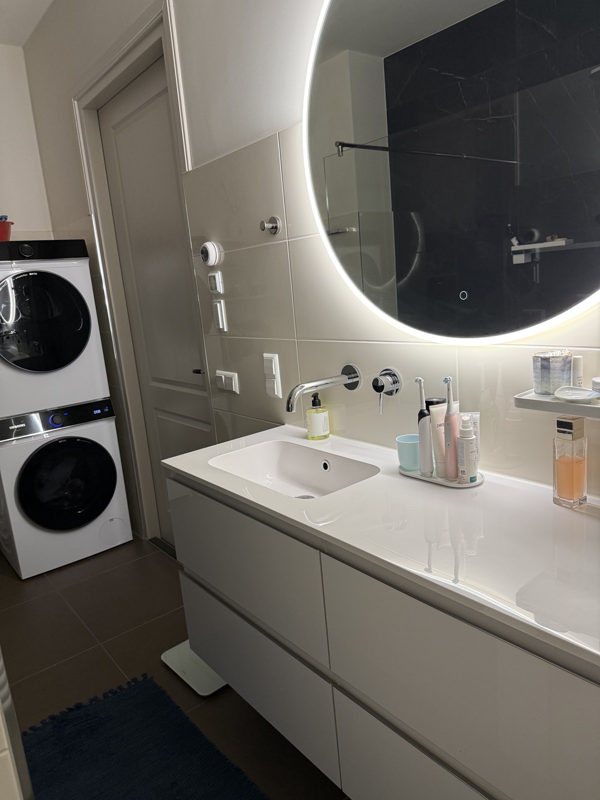 Bathroom vanity and stacked washer/dryer